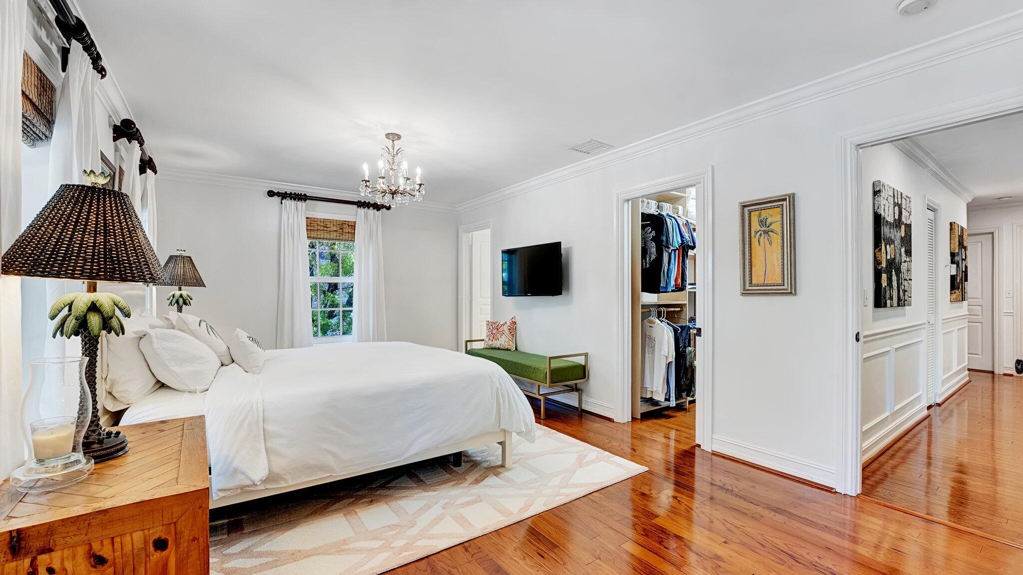 306 North Swinton Avenue Delray Beach, FL 33444 - Photo 27 of 53 a bedroom with a bed and a flat tv screen on dresser