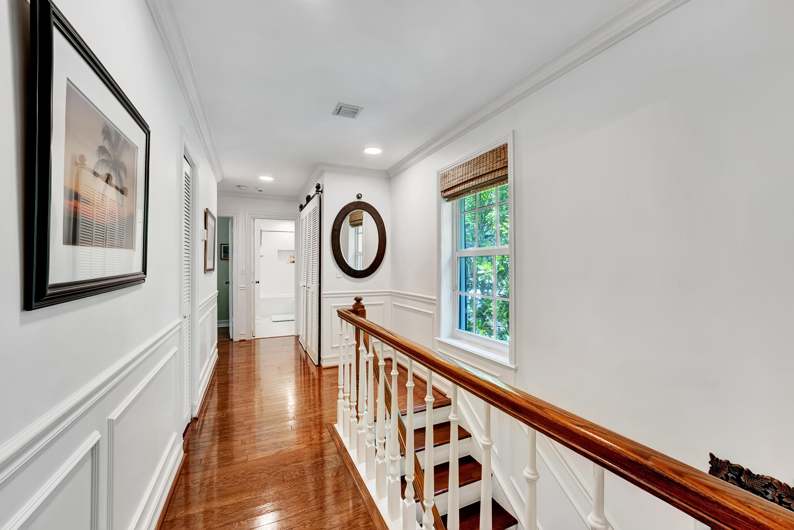 306 North Swinton Avenue Delray Beach, FL 33444 - Photo 35 of 53 a view of a hallway with wooden floor and windows