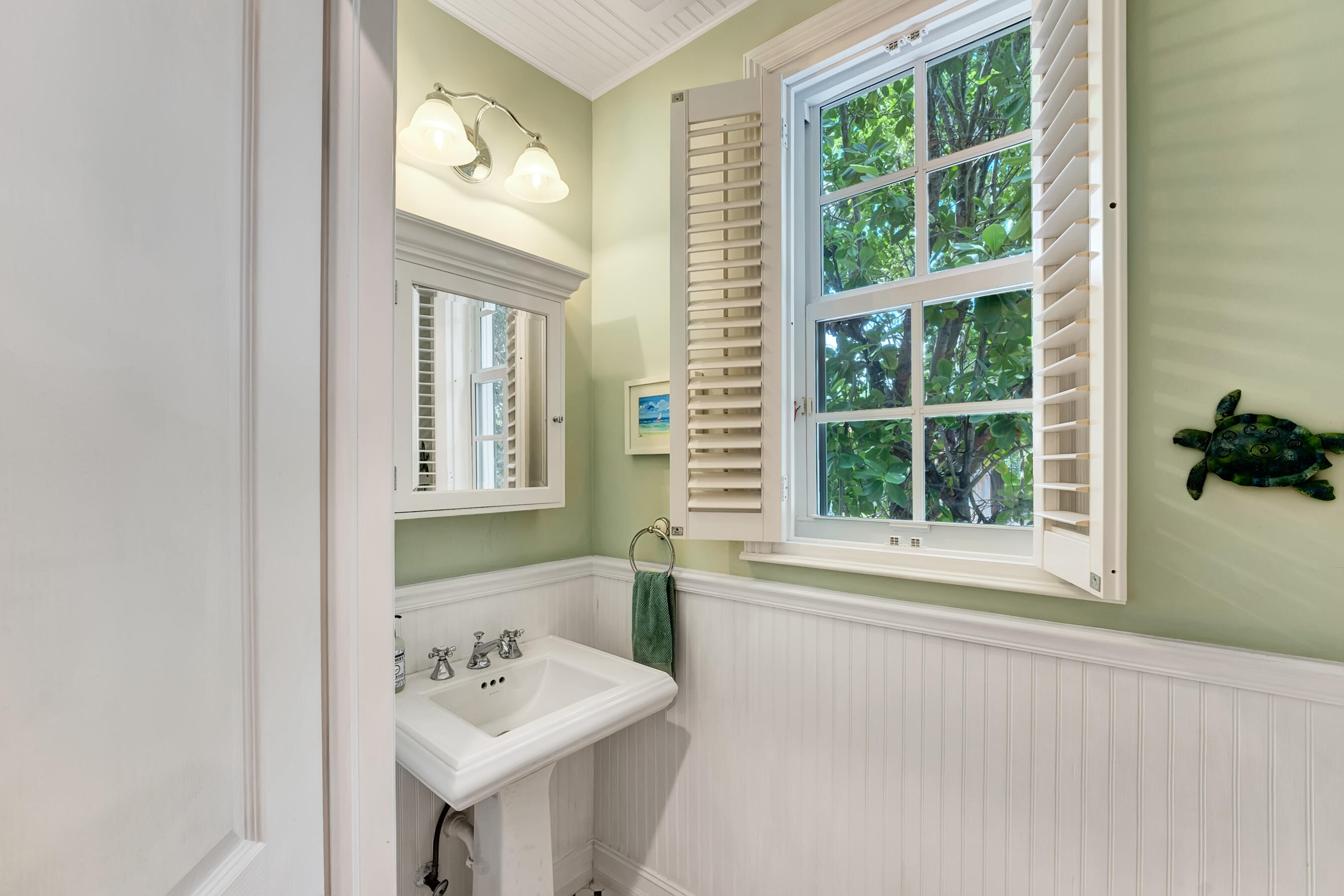 306 North Swinton Avenue Delray Beach, FL 33444 - Photo 36 of 53 a bathroom with a sink and a mirror