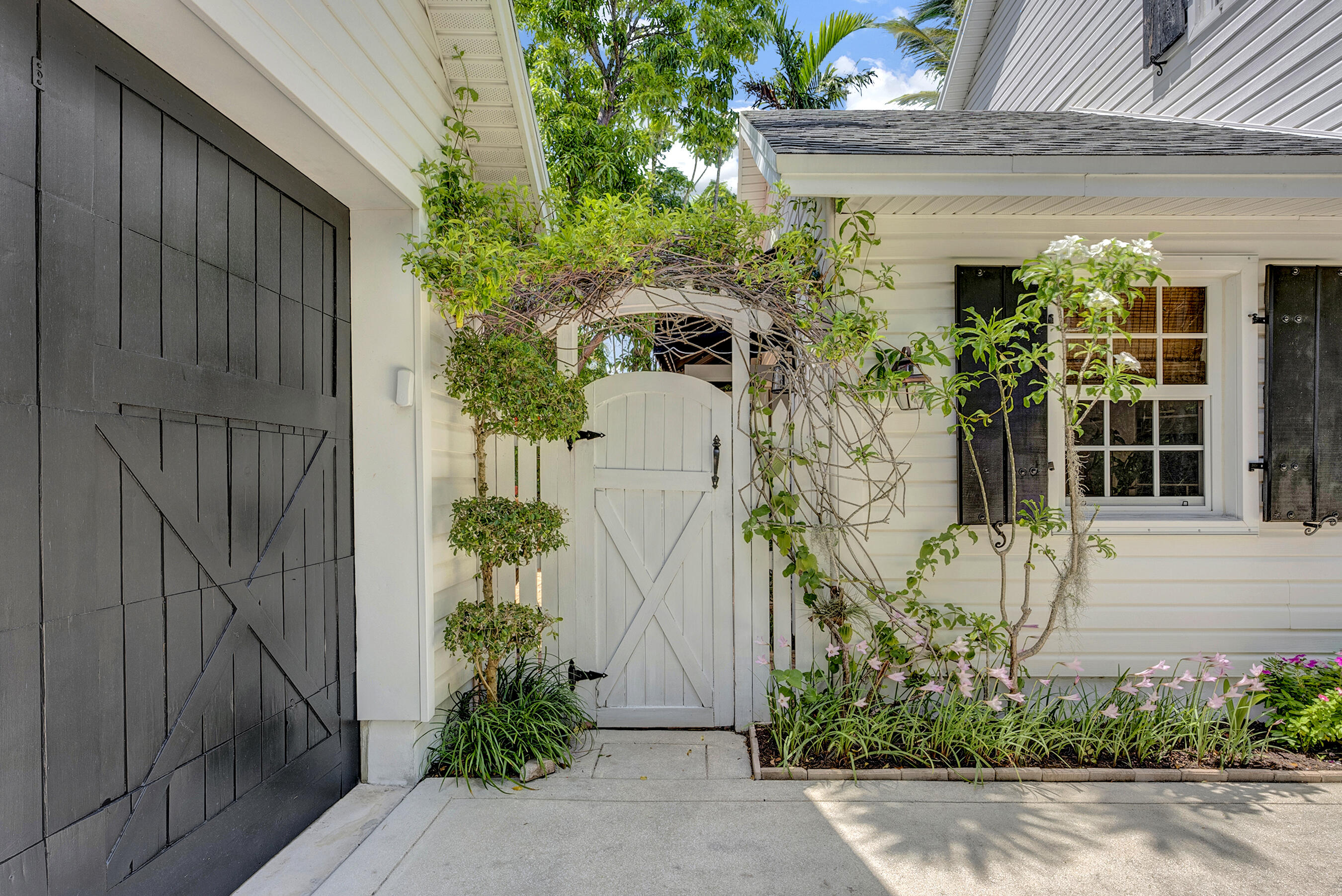 306 North Swinton Avenue Delray Beach, FL 33444 - Photo 46 of 53 front view of a house with potted plants