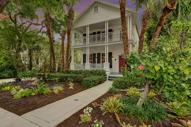 a balcony with chairs and wooden floor