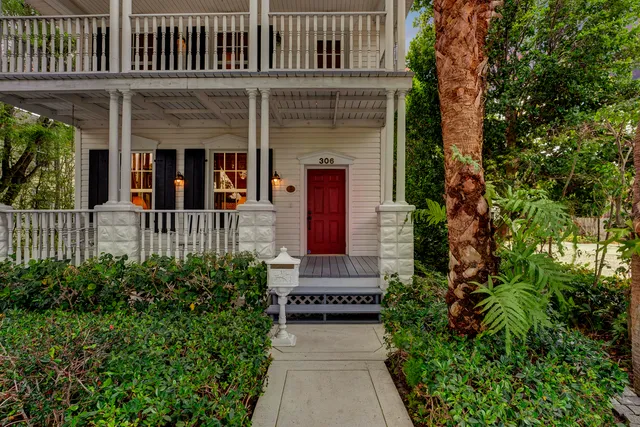 front view of a house with potted plants