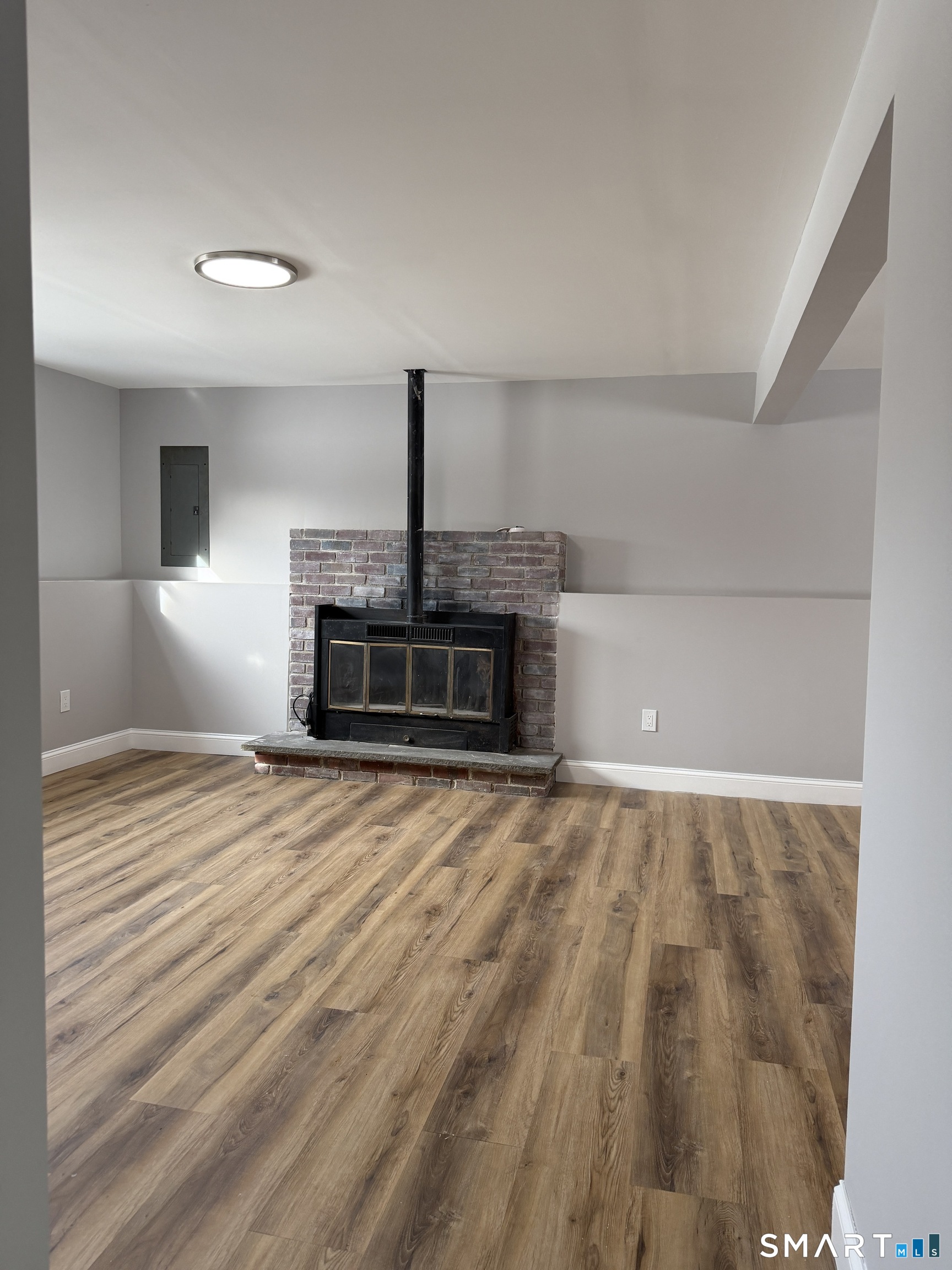 131 Pocono Road Brookfield, CT 06804 - Photo 15 of 27 a view of empty room with wooden floor