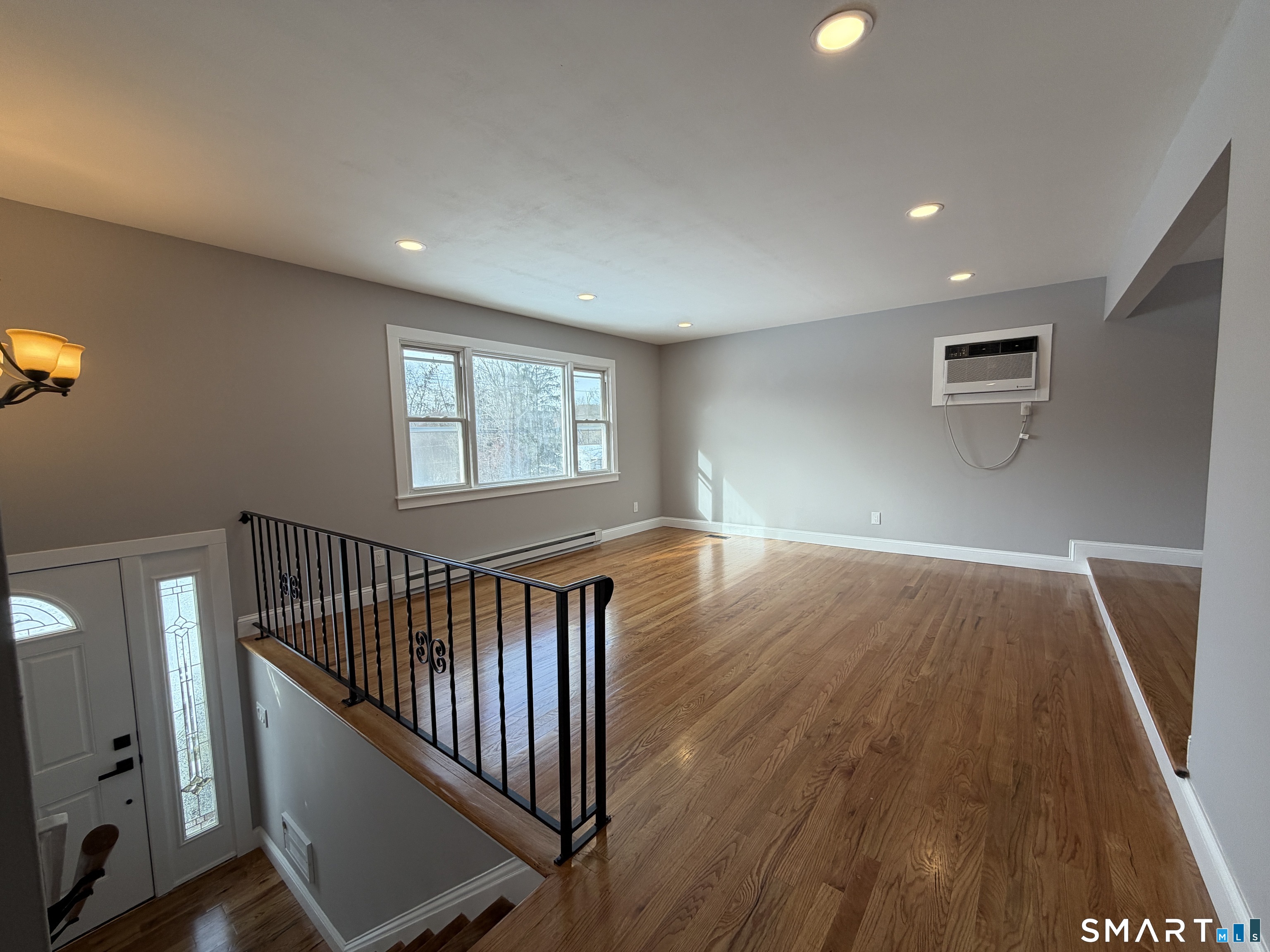 131 Pocono Road Brookfield, CT 06804 - Photo 27 of 27 wooden floor in an empty room with a window