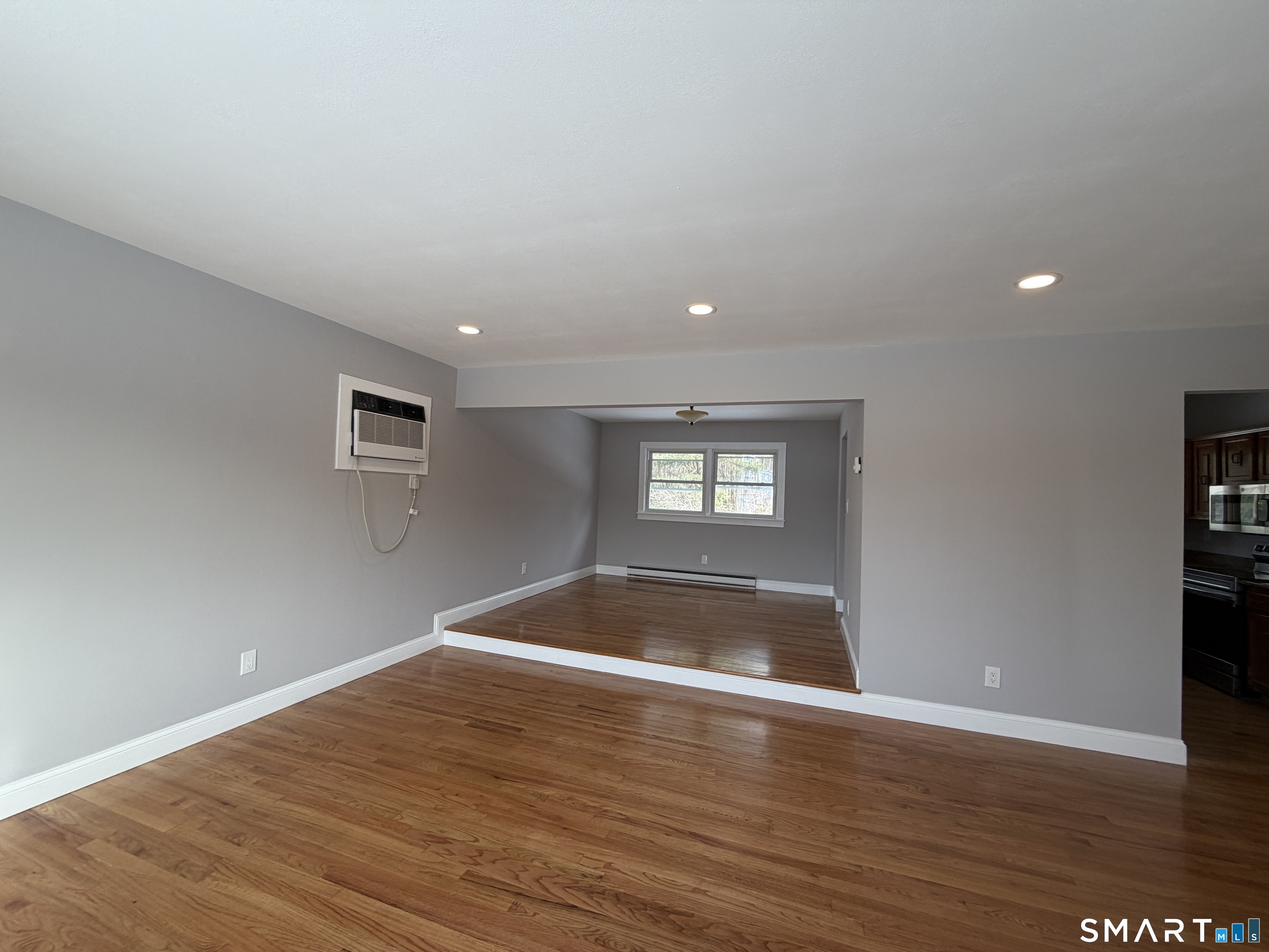 131 Pocono Road Brookfield, CT 06804 - Photo 5 of 27 a view of empty room with wooden floor and entryway