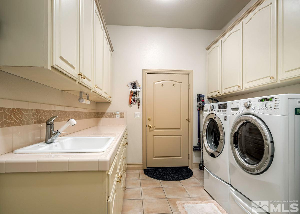 39 Sawbuck Road Reno, NV 89519 - Photo 15 of 23 a utility room with sink dryer and washer
