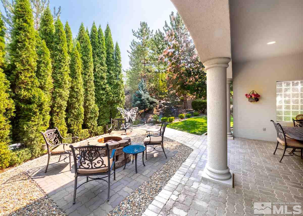 39 Sawbuck Road Reno, NV 89519 - Photo 19 of 23 a view of a patio with table and chairs and potted plants