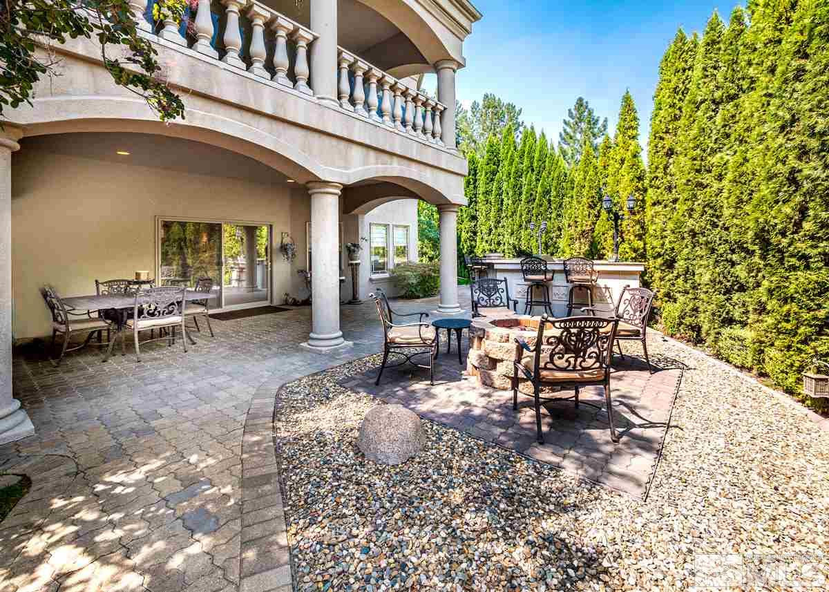 39 Sawbuck Road Reno, NV 89519 - Photo 20 of 23 a view of a patio with table and chairs and potted plants