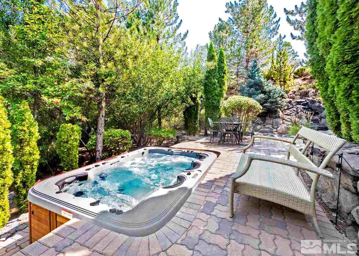 39 Sawbuck Road Reno, NV 89519 - Photo 2 of 23 a view of a swimming pool with a patio