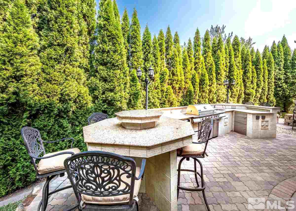 39 Sawbuck Road Reno, NV 89519 - Photo 21 of 23 a roof deck with a table and chairs