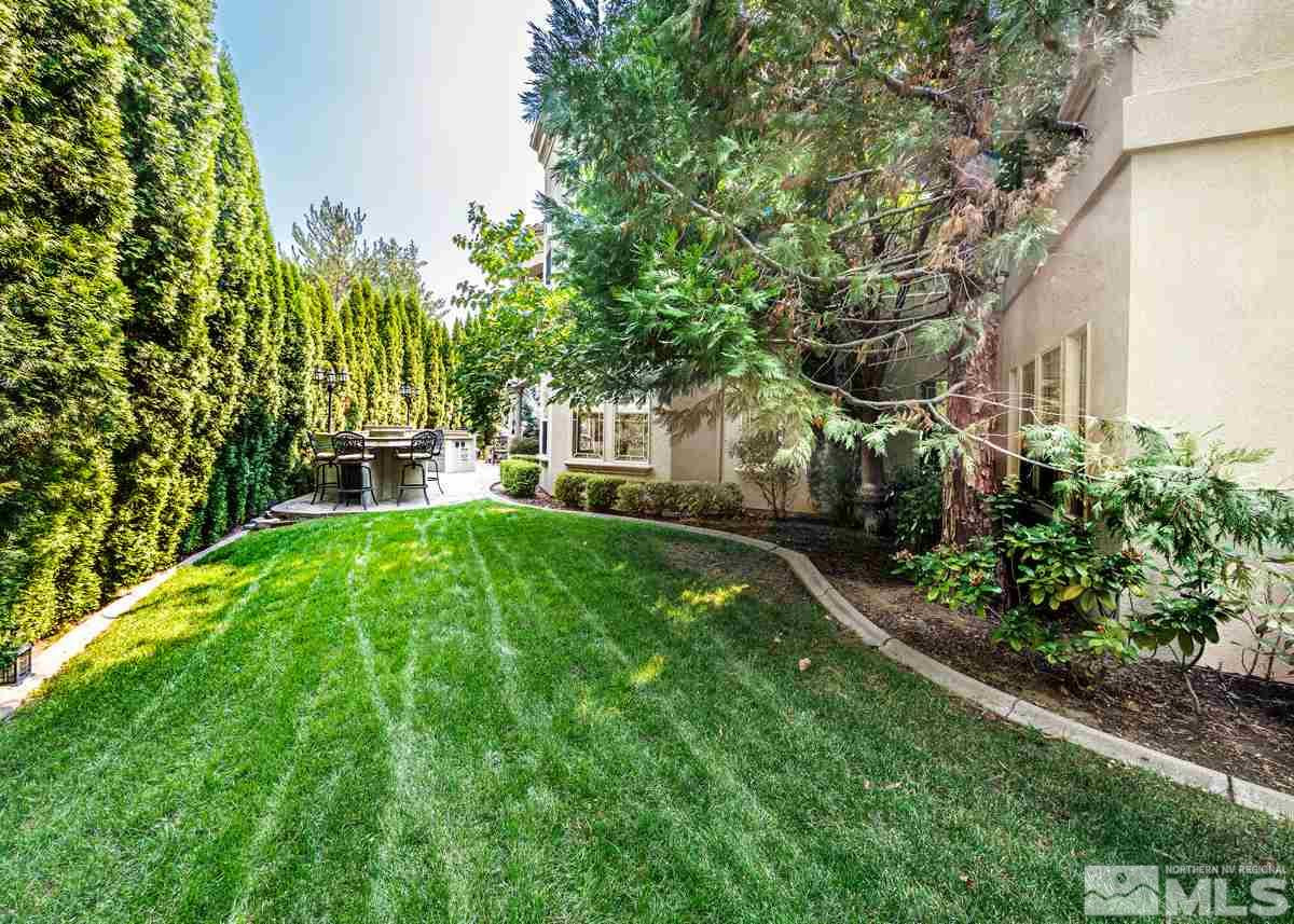 39 Sawbuck Road Reno, NV 89519 - Photo 23 of 23 a view of a yard with plants and large trees