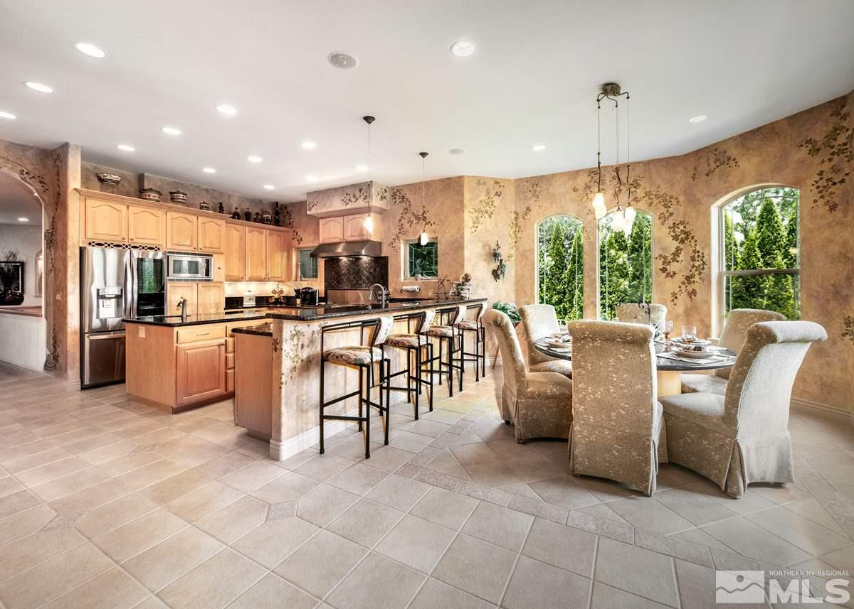 39 Sawbuck Road Reno, NV 89519 - Photo 7 of 23 a large kitchen with stainless steel appliances lots of counter top space