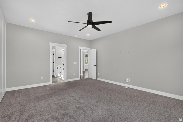 36 West Syracuse Road Vineyard, UT 84059 - Photo 26 of 56 Spacious carpeted room featuring a ceiling fan, recessed lighting, and white trim molding