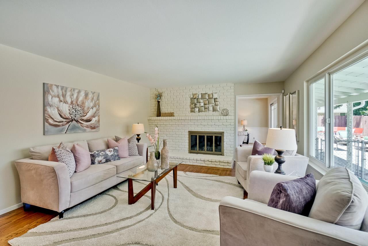 18665 Aspesi Drive Saratoga, CA 95070 - Photo 14 of 39 a living room with furniture and a fireplace