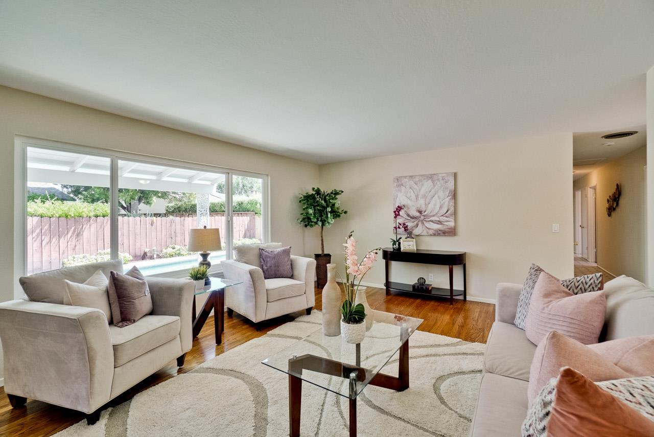18665 Aspesi Drive Saratoga, CA 95070 - Photo 17 of 39 a living room with furniture and a large window