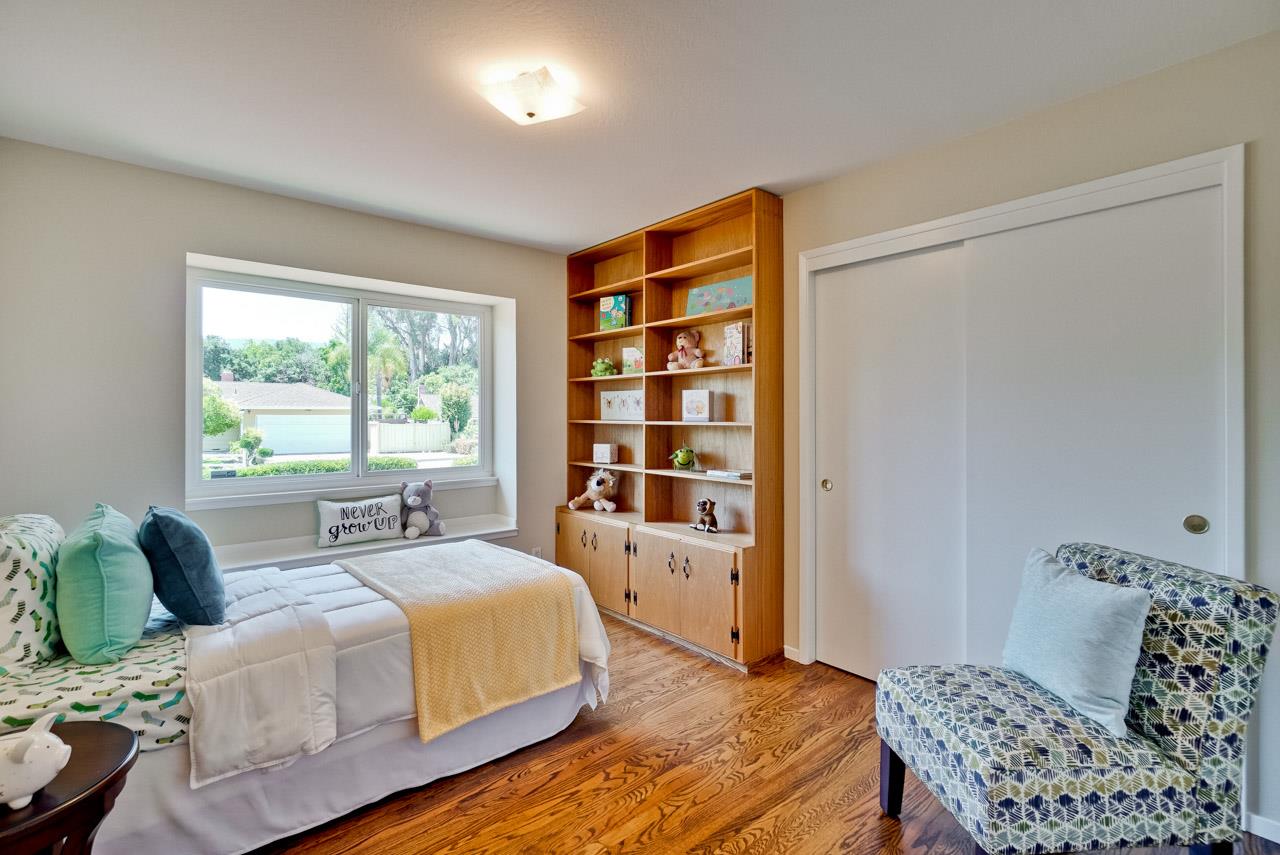 18665 Aspesi Drive Saratoga, CA 95070 - Photo 20 of 39 a bedroom with a bed and a window