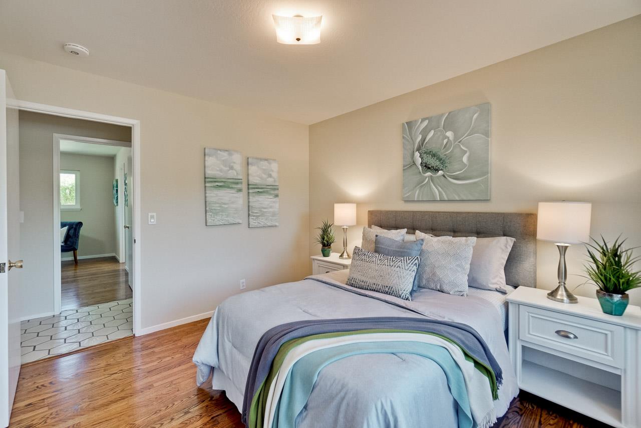 18665 Aspesi Drive Saratoga, CA 95070 - Photo 23 of 39 a bedroom with bed and wooden floor