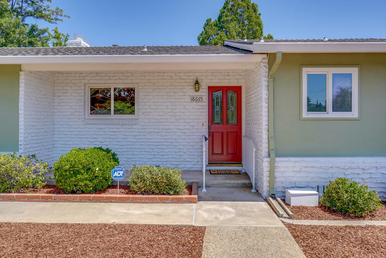 18665 Aspesi Drive Saratoga, CA 95070 - Photo 3 of 39 a front view of a house with a yard and garage