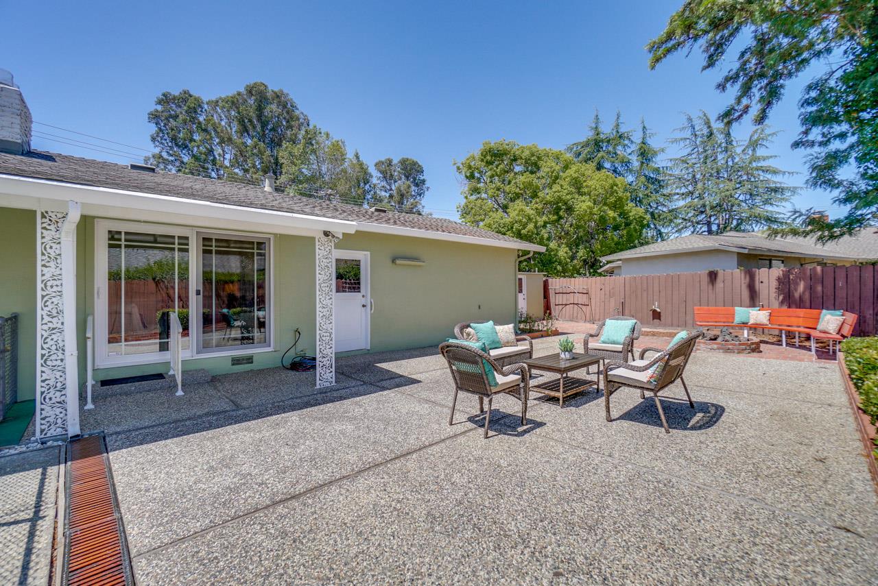 18665 Aspesi Drive Saratoga, CA 95070 - Photo 36 of 39 a backyard of a house with table and chairs