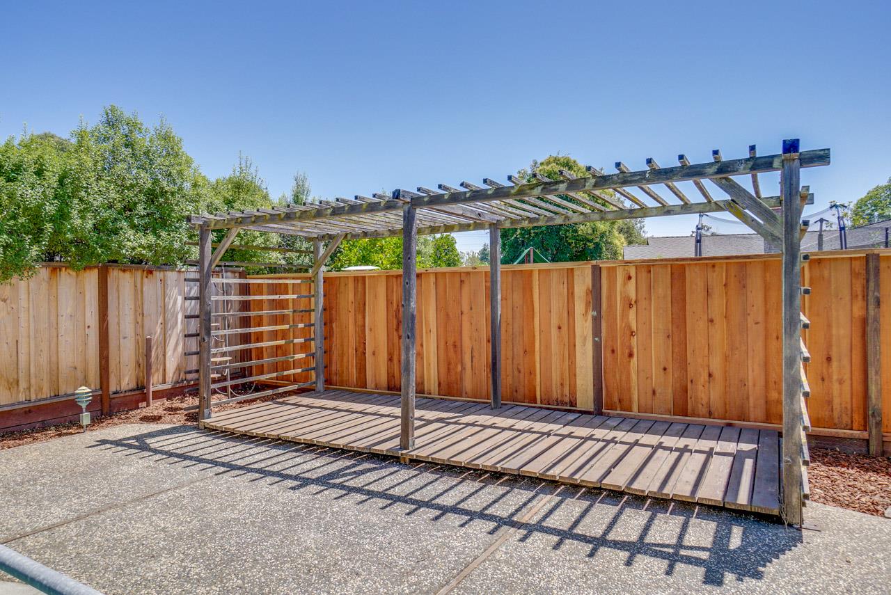 18665 Aspesi Drive Saratoga, CA 95070 - Photo 37 of 39 a view of a backyard with a fence and plants