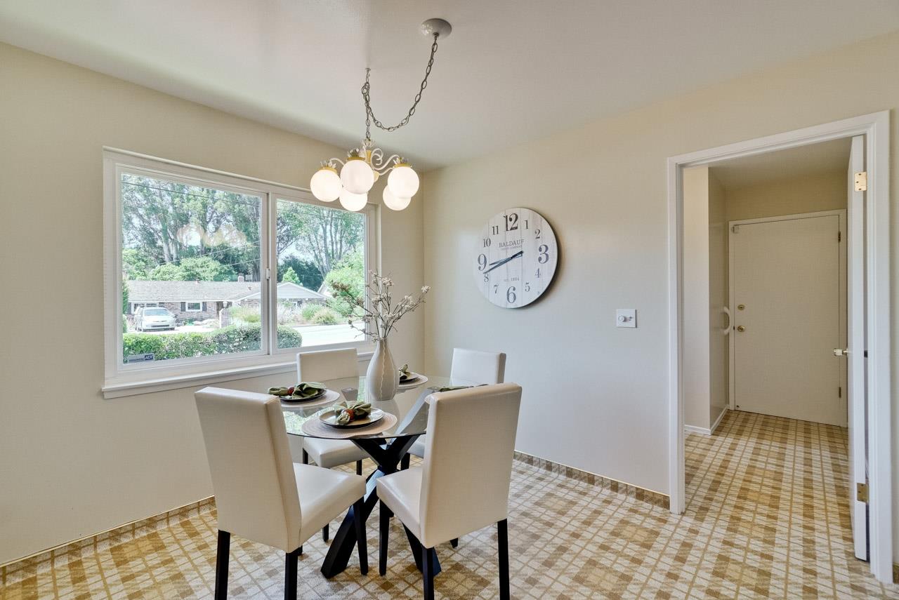 18665 Aspesi Drive Saratoga, CA 95070 - Photo 9 of 39 a view of a dining room with furniture a chandelier and wooden floor