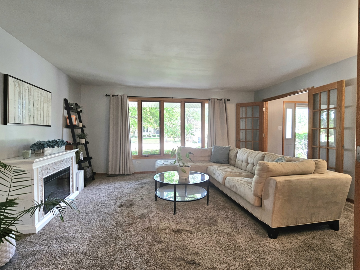 19451 Lancaster Drive Mokena, IL 60448 - Photo 14 of 32 a living room with furniture a fireplace and a large window