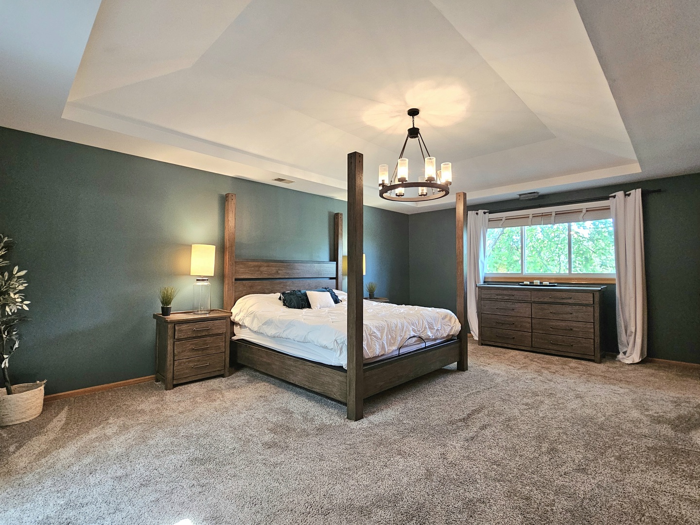 19451 Lancaster Drive Mokena, IL 60448 - Photo 18 of 32 a bedroom with a bed and a chandelier