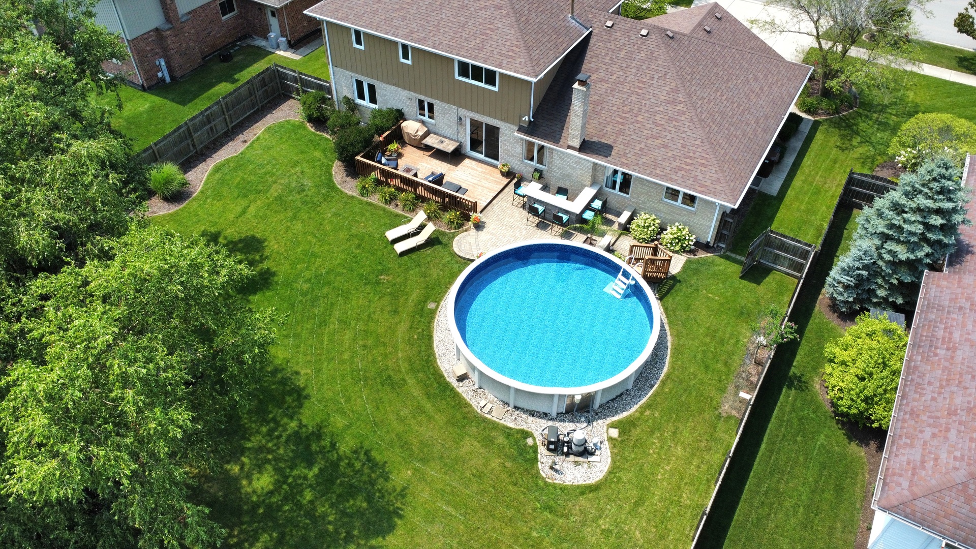 19451 Lancaster Drive Mokena, IL 60448 - Photo 29 of 32 an aerial view of a house with garden space and swimming pool