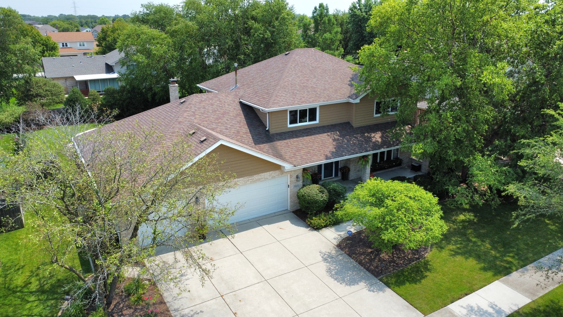 19451 Lancaster Drive Mokena, IL 60448 - Photo 32 of 32 a aerial view of a house with a yard and potted plants