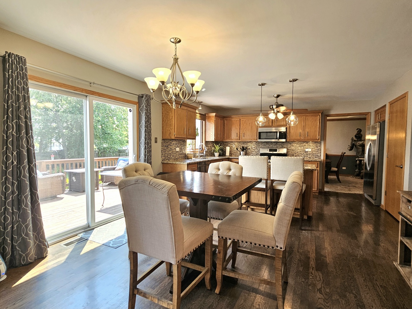 19451 Lancaster Drive Mokena, IL 60448 - Photo 7 of 32 a view of a dining room and livingroom with furniture wooden floor a chandelier