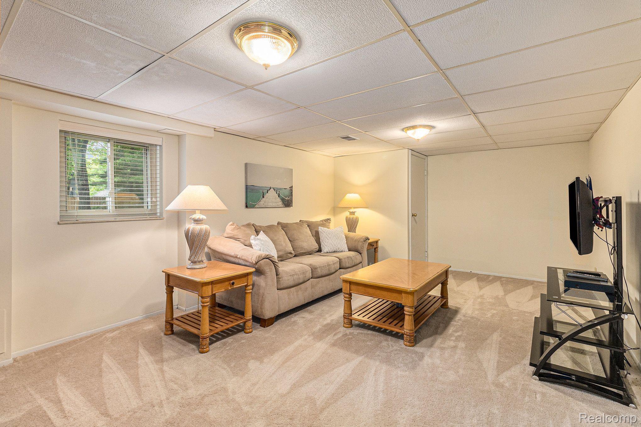1746 Ridge Road White Lake, MI 48383 - Photo 25 of 39 Large Finished Living Room in the Basement