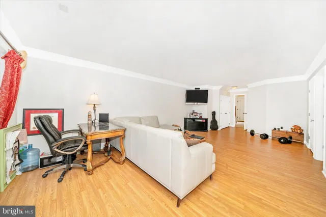 a living room with furniture and white walls