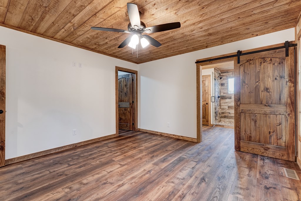 3448 Lickskillet Road Epworth, GA 30541 - Photo 14 of 71 a view of an empty room with wooden floor
