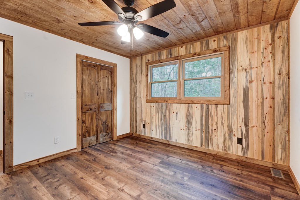 3448 Lickskillet Road Epworth, GA 30541 - Photo 20 of 71 an empty room with wooden floor and windows