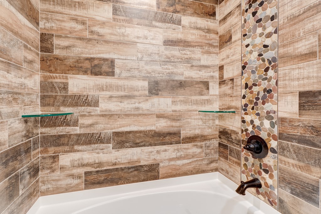 3448 Lickskillet Road Epworth, GA 30541 - Photo 23 of 71 a bathroom with a bathtub and a shower