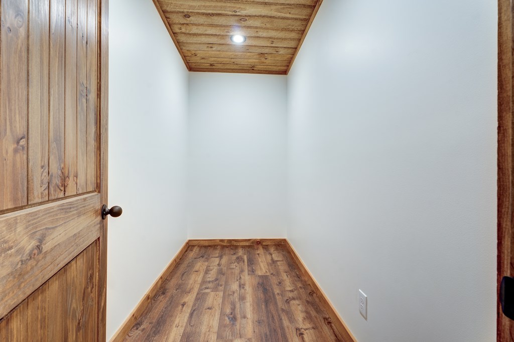 3448 Lickskillet Road Epworth, GA 30541 - Photo 43 of 71 a view of a hallway with wooden floor and staircase