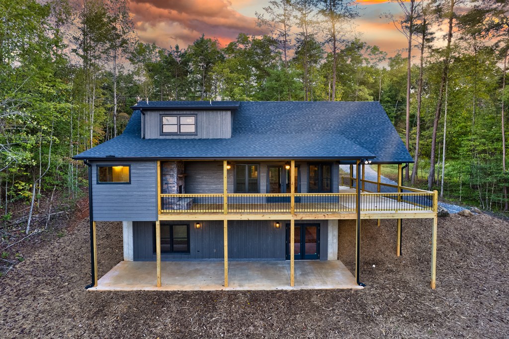 3448 Lickskillet Road Epworth, GA 30541 - Photo 49 of 71 a view of a house with a yard and floor to ceiling window