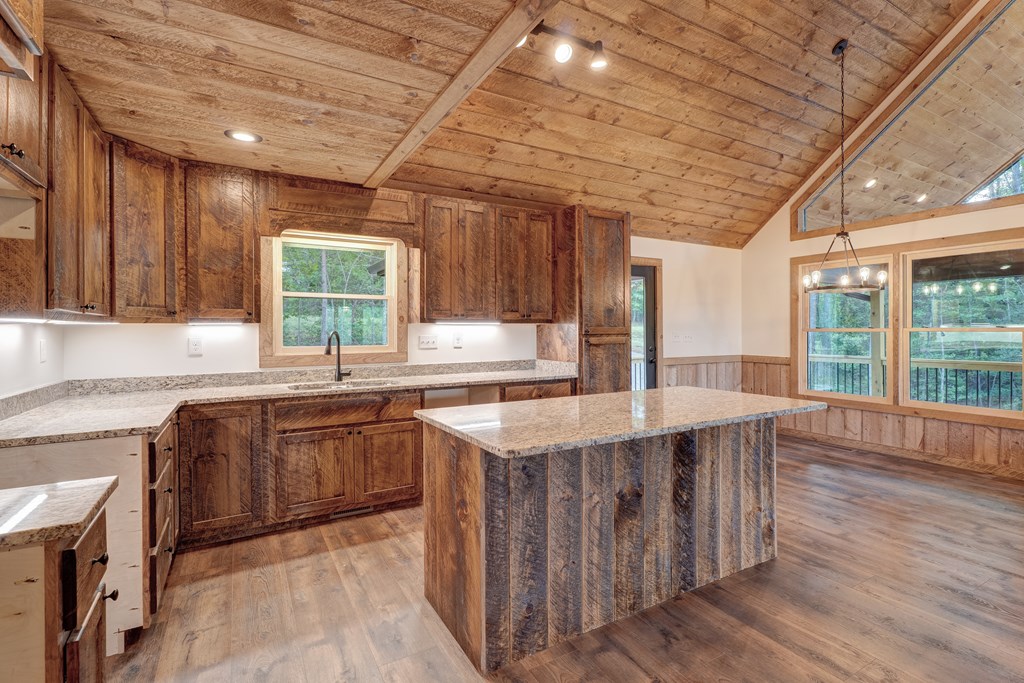 3448 Lickskillet Road Epworth, GA 30541 - Photo 6 of 71 a kitchen with stainless steel appliances granite countertop sink stove top oven and cabinets