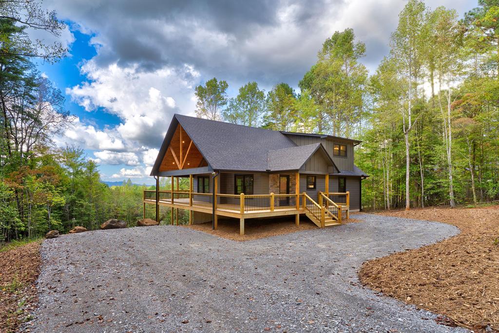 3448 Lickskillet Road Epworth, GA 30541 - Photo 64 of 71 a view of a house with a yard and balcony