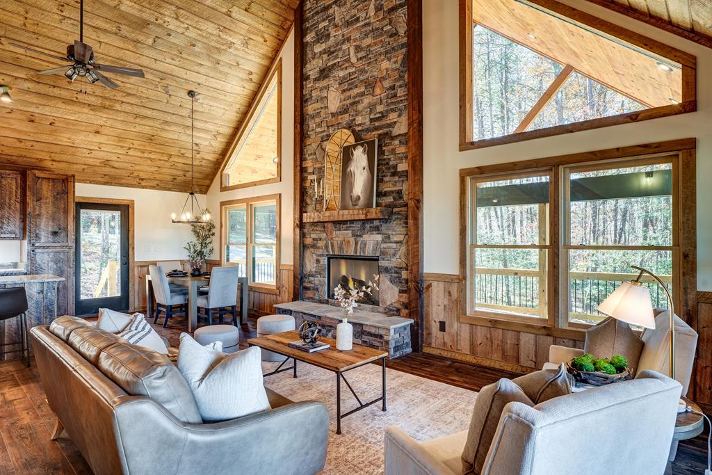 3448 Lickskillet Road Epworth, GA 30541 - Photo 65 of 71 a living room with fireplace furniture and a large window