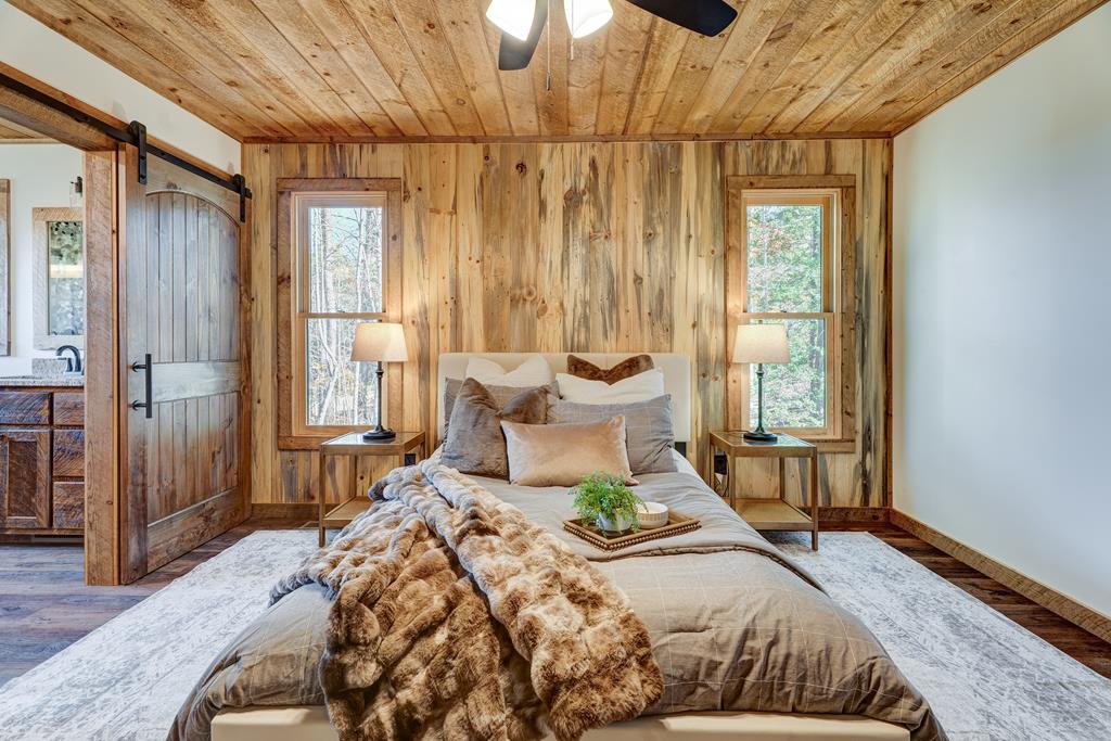 3448 Lickskillet Road Epworth, GA 30541 - Photo 68 of 71 a bedroom with a bed and wooden floor