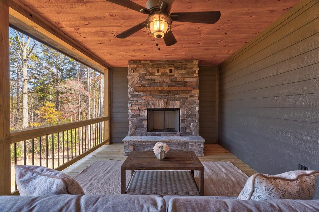 3448 Lickskillet Road Epworth, GA 30541 - Photo 70 of 71 a living room with furniture and a fireplace