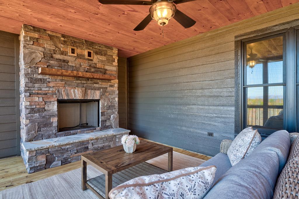 3448 Lickskillet Road Epworth, GA 30541 - Photo 71 of 71 a living room with furniture and a fireplace
