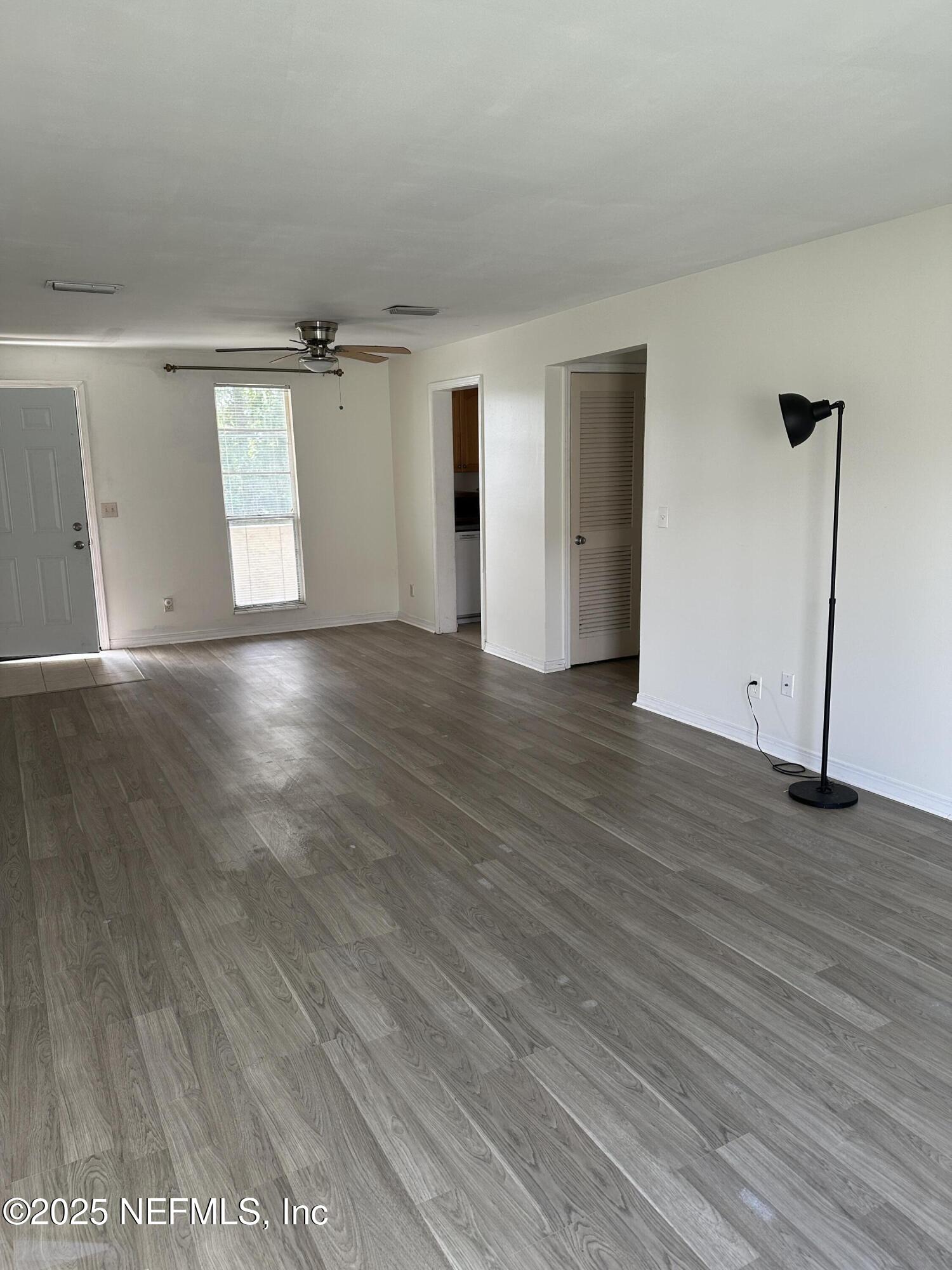 1756 El Prado Road, Unit 3 Jacksonville, FL 32216 - Photo 17 of 23 an empty room with wooden floor and windows