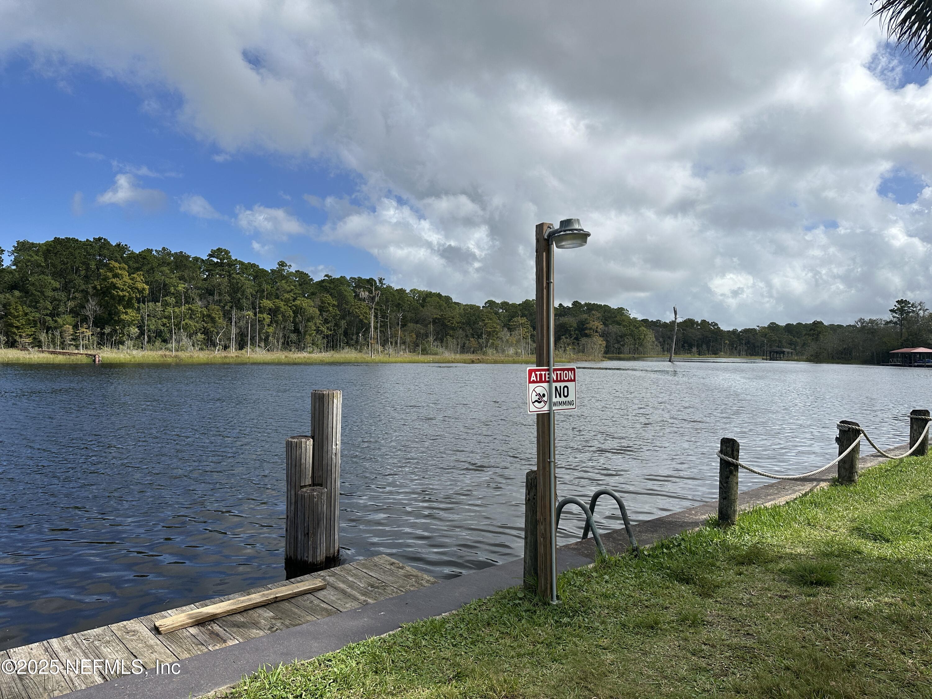 1756 El Prado Road, Unit 3 Jacksonville, FL 32216 - Photo 21 of 23 a view of a lake with houses in the back