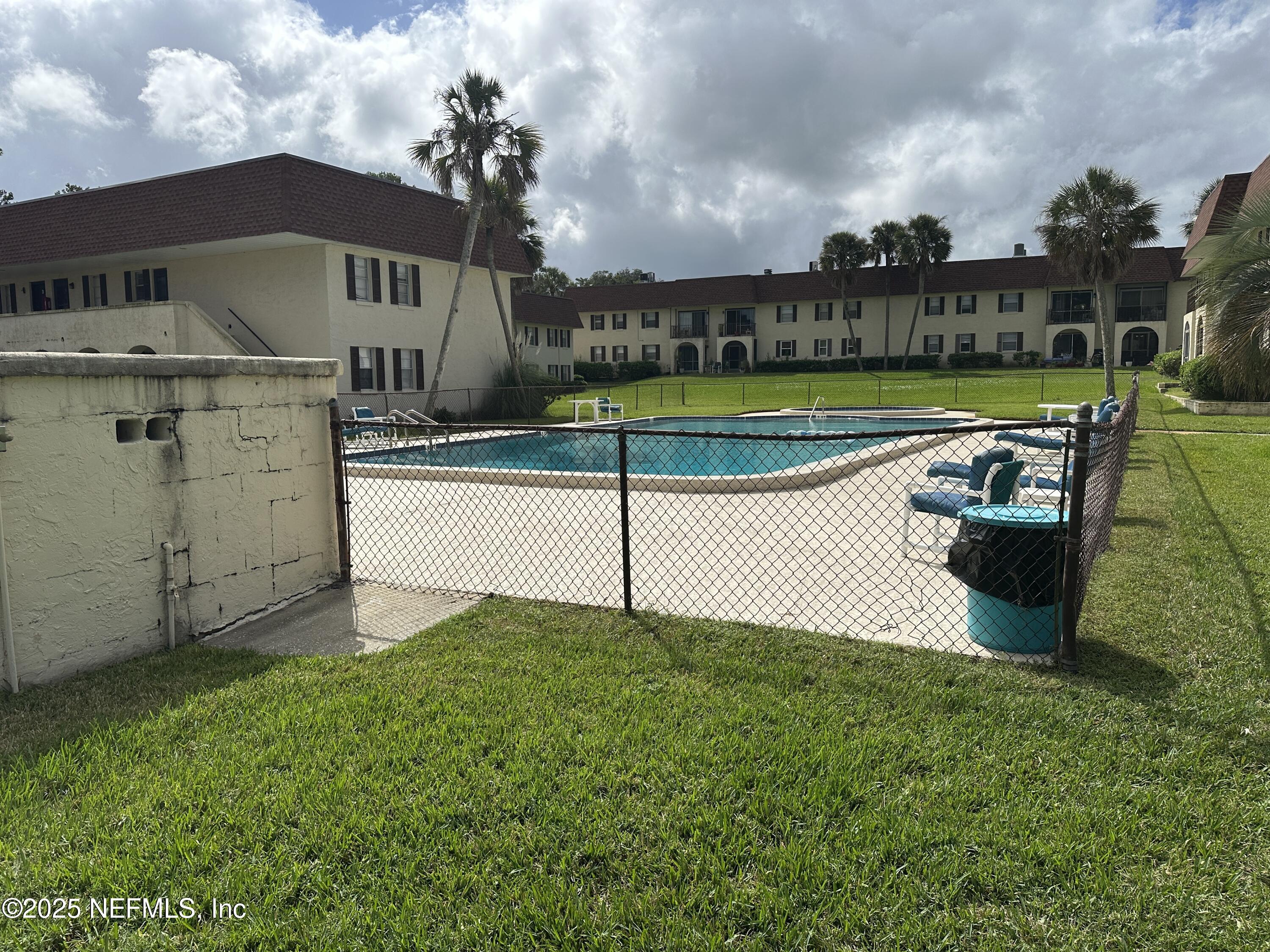 1756 El Prado Road, Unit 3 Jacksonville, FL 32216 - Photo 22 of 23 a view of a house with a yard and sitting area