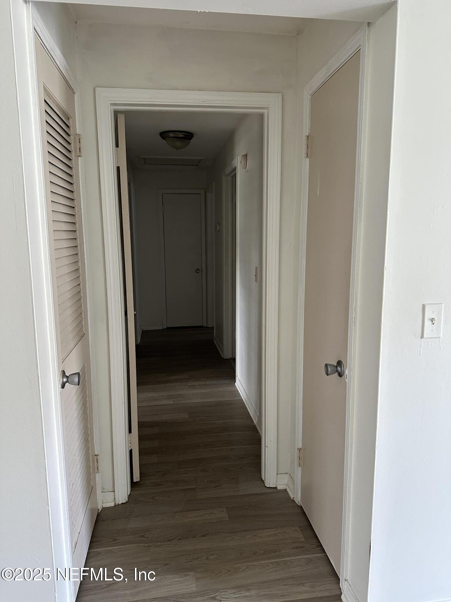 1756 El Prado Road, Unit 3 Jacksonville, FL 32216 - Photo 7 of 23 a view of a hallway with wooden floor