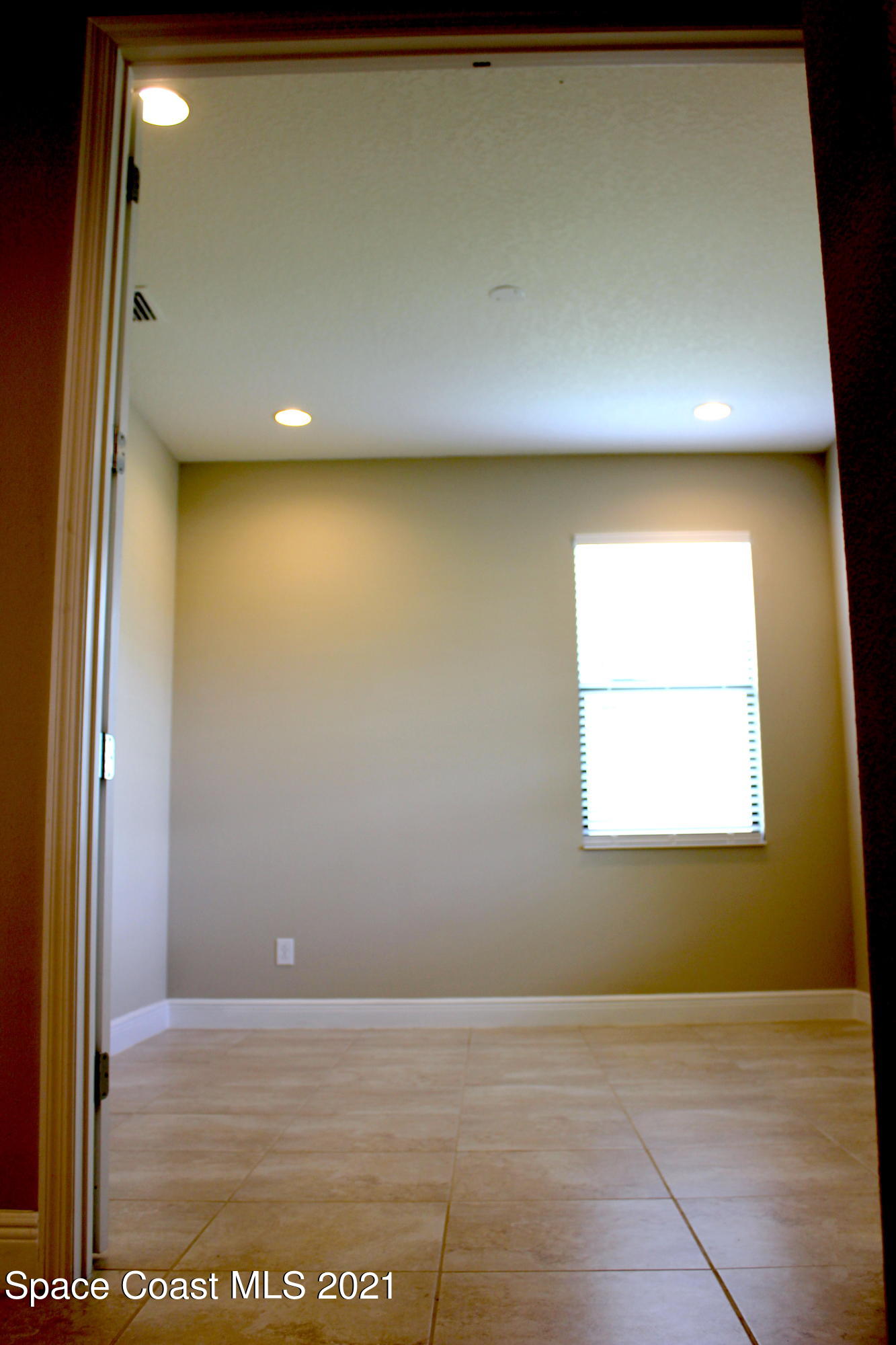 3630 Stabane Place Melbourne, FL 32940 - Photo 12 of 24 a view of an empty room with a window