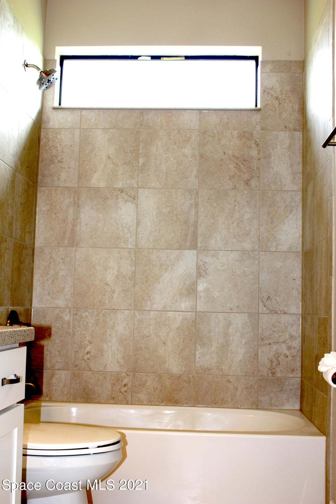 3630 Stabane Place Melbourne, FL 32940 - Photo 16 of 24 a bathroom with a sink and a mirror