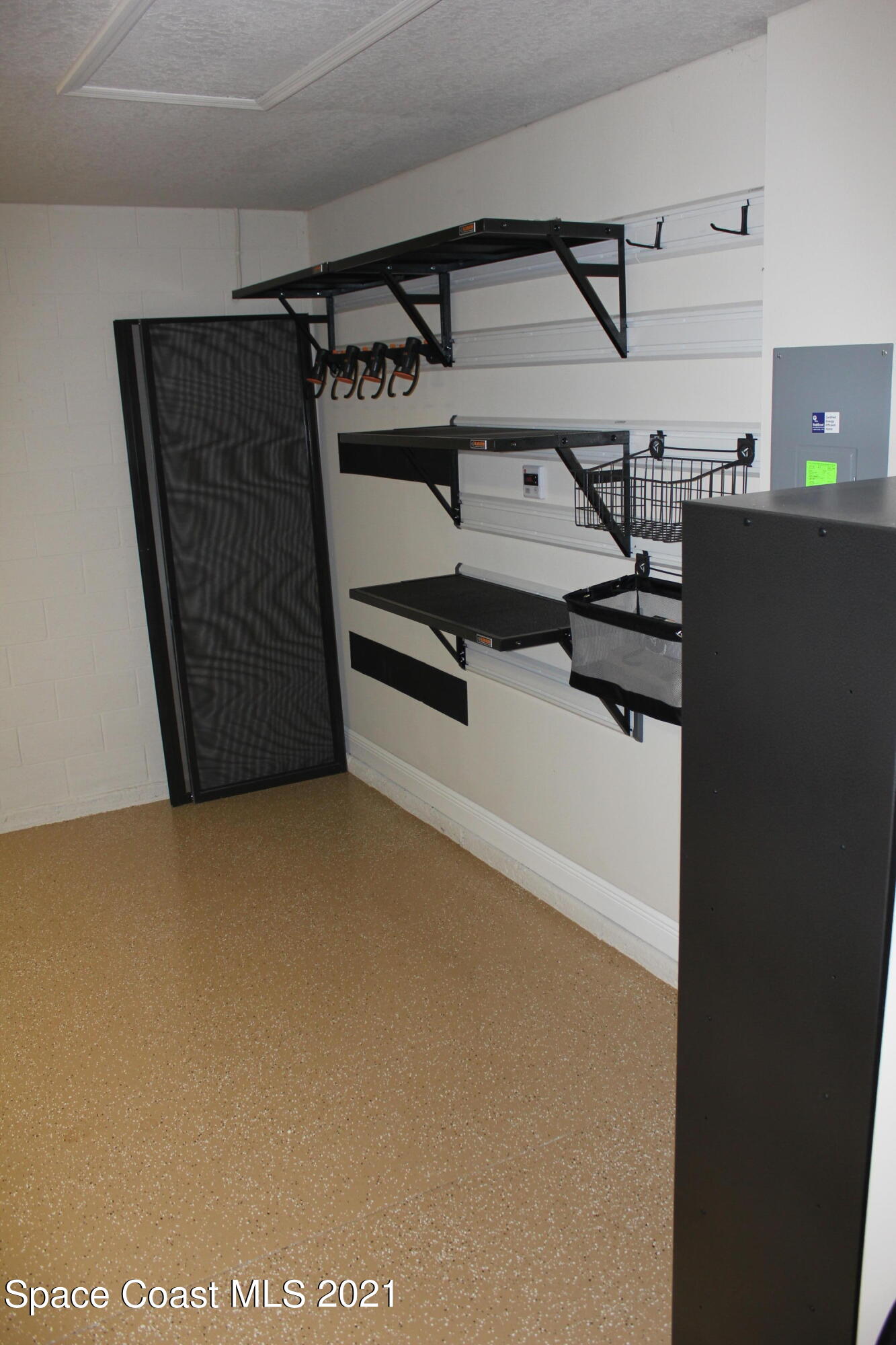 3630 Stabane Place Melbourne, FL 32940 - Photo 22 of 24 a view of storage and utility room with washer and dryer